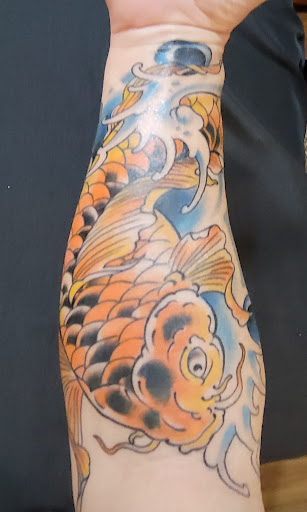 Explore cat tattoo idea, creative tattoo ideas in Powell, available at Tattoo Saga