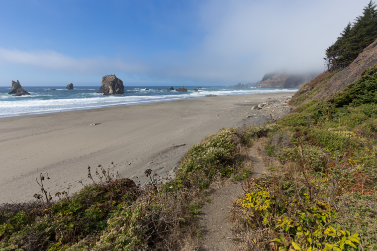 Photo of China Beach with gray sand surface