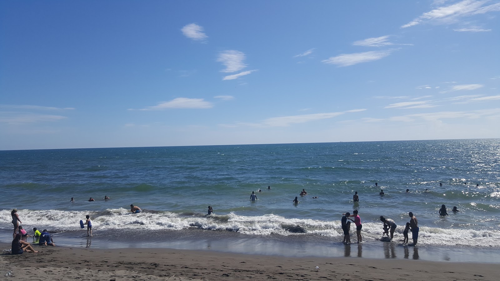 Foto av Playa de Estero Rico med lång rak strand