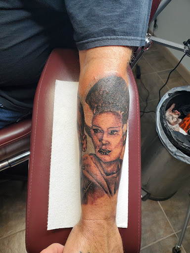 Explore reading tattoo ideas, creative tattoo ideas in Fort Gratiot, available at Stained Glass Tattoo & Body Piercing