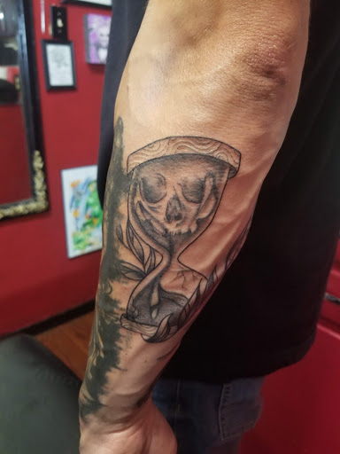 Explore cover up flower tattoo ideas, creative tattoo ideas in Modesto, available at Red Dragon Tattoo