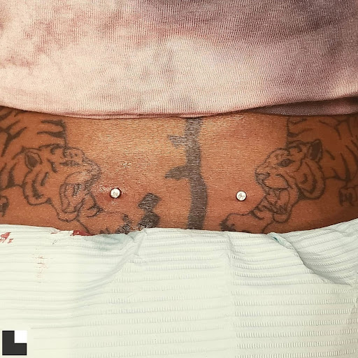 Explore small tattoo ideas behind the ear, creative tattoo ideas in Charleston, available at Exotic Impressions Body Piercing