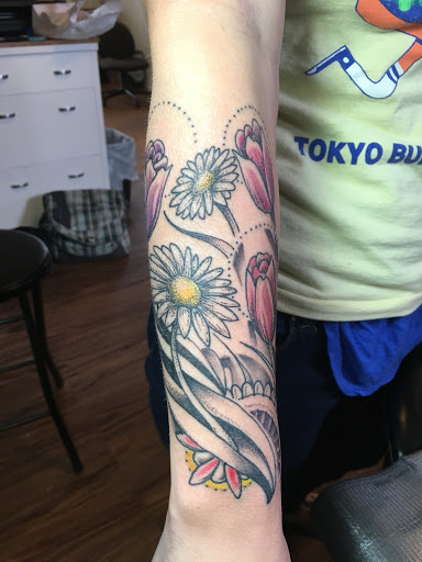 Explore side boob tattoo ideas, creative tattoo ideas in Milford, available at Golden Hammer Tattoo Studios