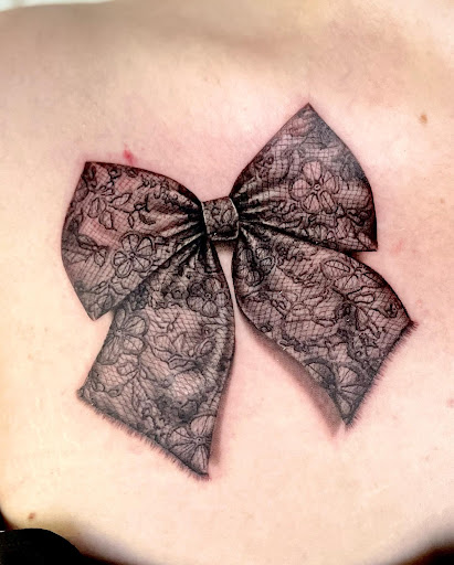 Explore black bear tattoo ideas, creative tattoo ideas in Pendleton, available at Just Another Hole in the Wall Tattoo