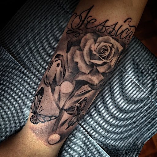 Explore comic book tattoo ideas, creative tattoo ideas in Corning, available at Prisma Ink Tattoos & Piercings