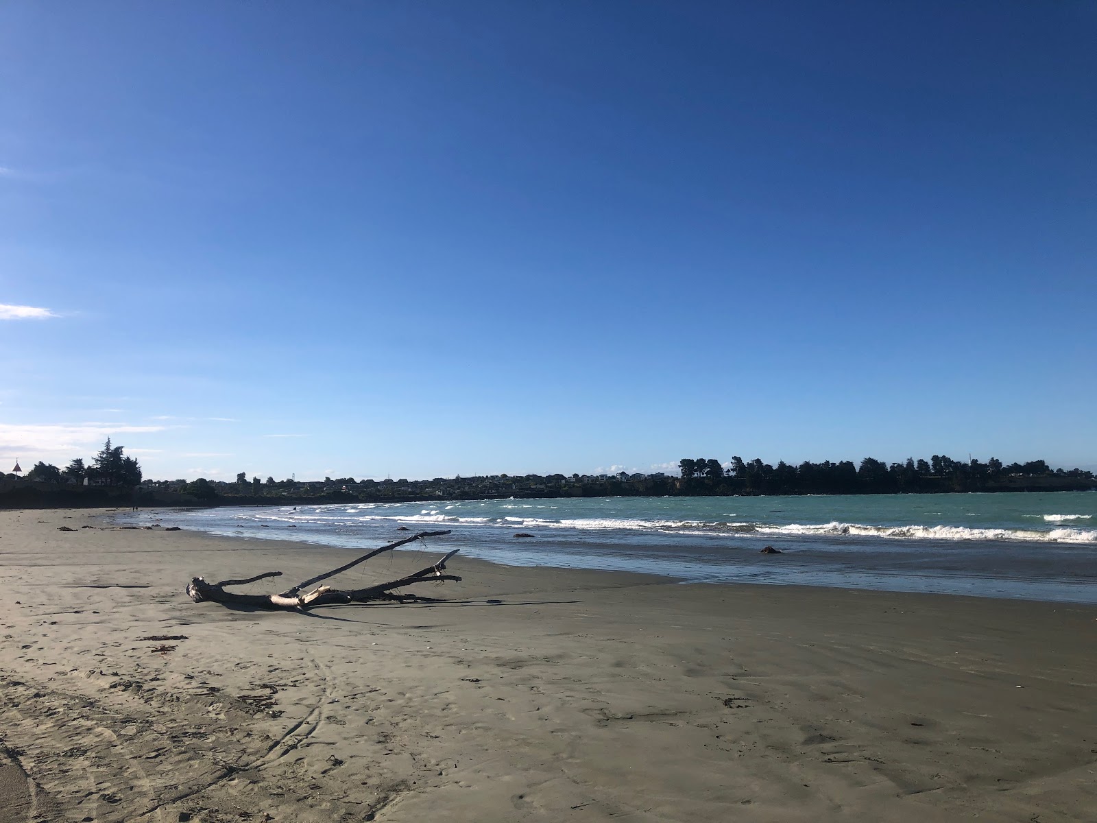 Photo of Caroline Bay Beach and the settlement