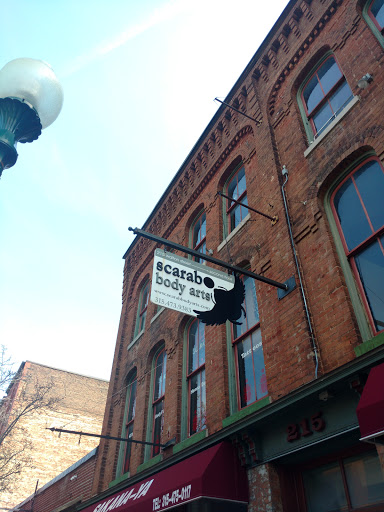 Explore portrait tattoo sleeve ideas, creative tattoo ideas in Syracuse, available at Scarab Body Arts