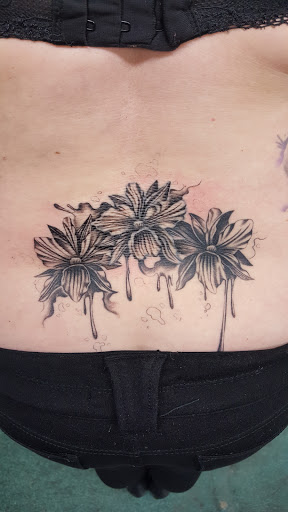 Find spinal cord tattoos ideas for your next unique tattoo in Bellevue at Skin and Soul Tattoo & Piercing