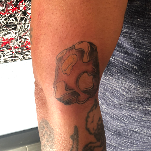 Explore cover up tattoo ideas for females, creative tattoo ideas in Palm Harbor, available at Angry Owl Tattoo and Piercing