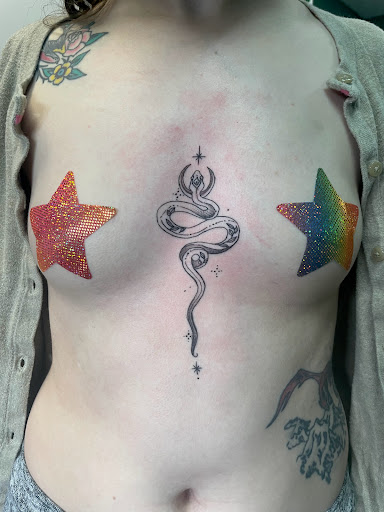 Explore red cardinal tattoo ideas, creative tattoo ideas in Meridian, available at Creative Pain Tattoo Studio