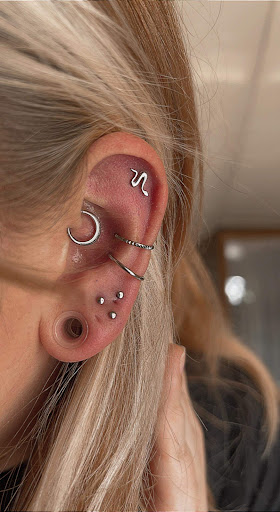 Explore dragon tattoo ideas forearm, creative tattoo ideas in Kirksville, available at Properly Pierced