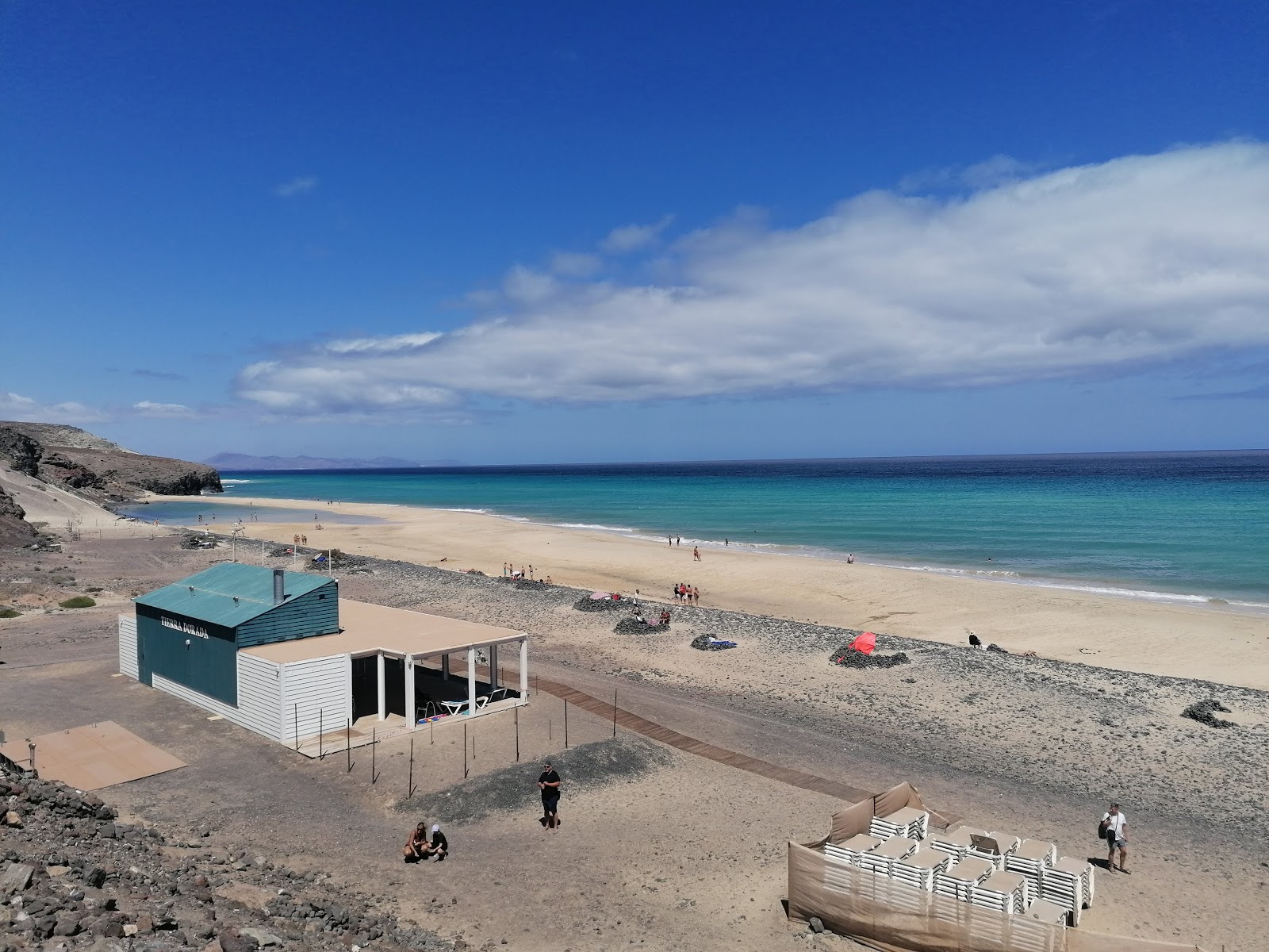 Foto van Playa Del Mal Nombre met helder fijn zand oppervlakte