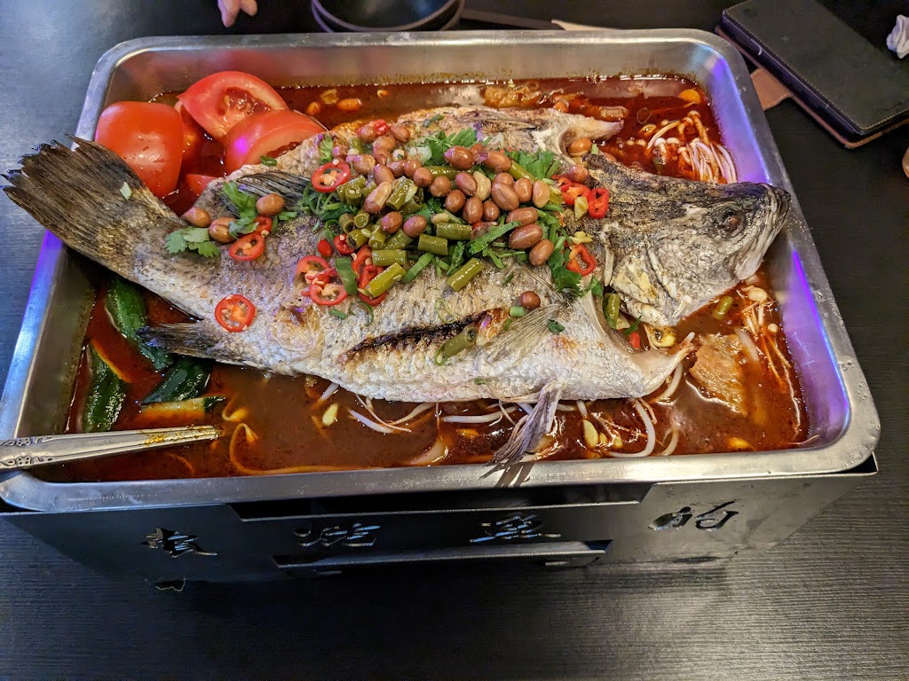 賣烤魚的。 的照片