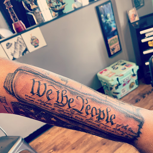 Explore black cover up tattoo ideas, creative tattoo ideas in Fort Oglethorpe, available at The Helm Tattoo & Piercing