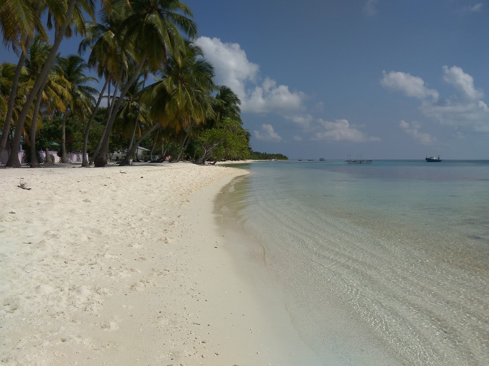 Photo de Sunset Beach avec sable lumineux de surface