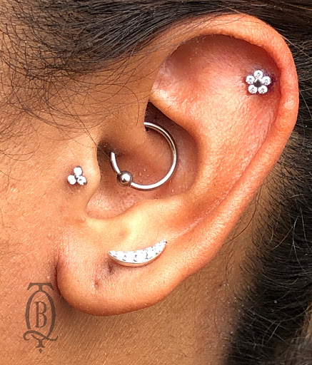 Explore thumb print tattoo ideas, creative tattoo ideas in Marietta, available at The Queen Bee Tattoo and Piercing Parlour