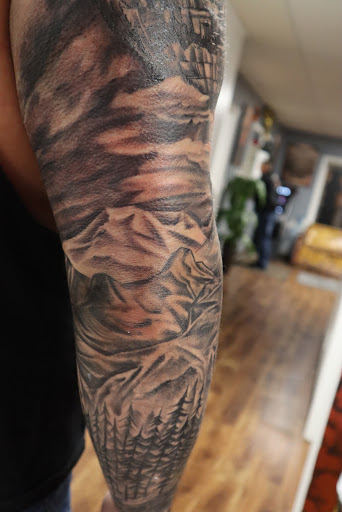 Explore outdoor tattoo ideas for men, creative tattoo ideas in Des Moines, available at Skin Kitchen Tattoo