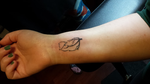 Explore dog and cat tattoo ideas, creative tattoo ideas in Knoxville, available at Vivid Tattoo