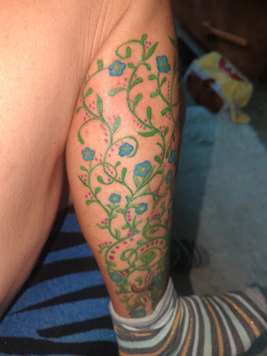 Explore flower bouquet tattoo ideas, creative tattoo ideas in Portland, available at Mi Bella Tattoo