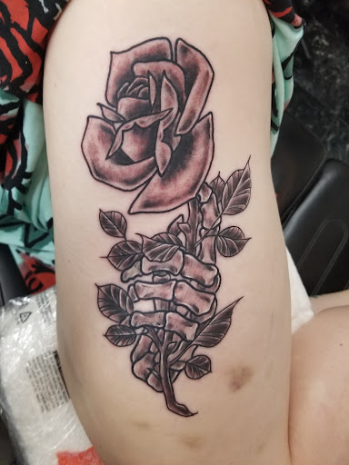 Explore iris tattoo ideas, creative tattoo ideas in Rogers, available at Saved by Grace Tattoo Studio