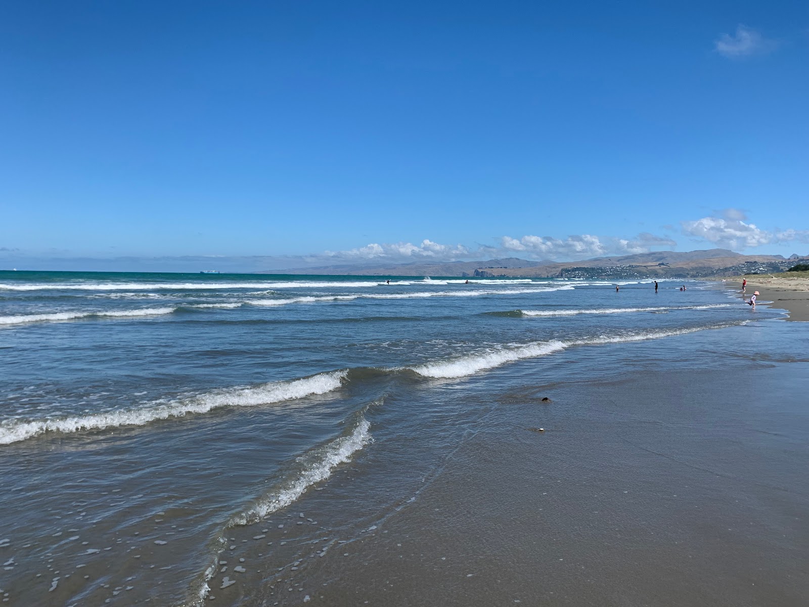 Foto de New Brighton Beach com água turquesa superfície