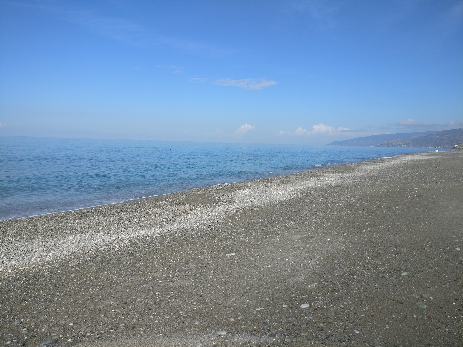 Fotografija Tamure beach in naselje