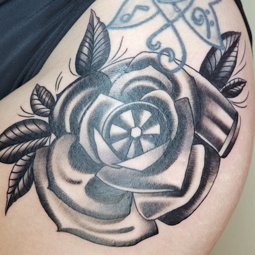 Explore quarter sized tattoo ideas, creative tattoo ideas in Bowling Green, available at BroadWing Tattoo and Body Piercing