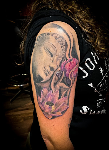 Find between the breast tattoo ideas for your next unique tattoo in Lander at Blackblood Tattoo and Piercing