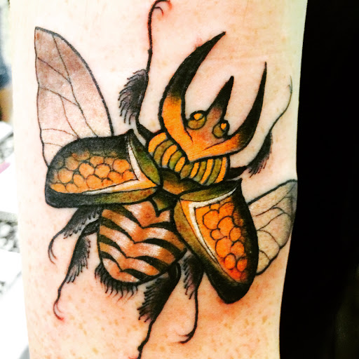 Explore rose thigh tattoo ideas, creative tattoo ideas in Pittsburgh, available at Pittsburgh Tattoo Company