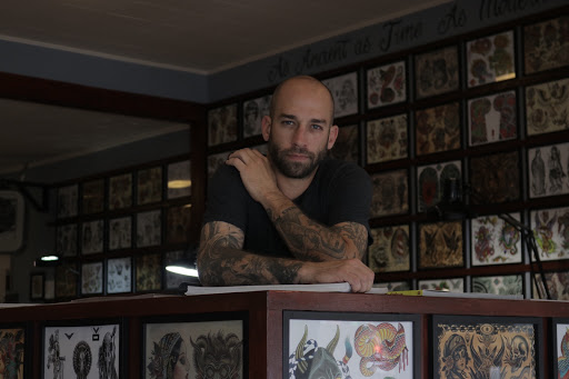 Explore men's back of neck tattoo ideas, creative tattoo ideas in Laramie, available at Vintage Electric Tattoo