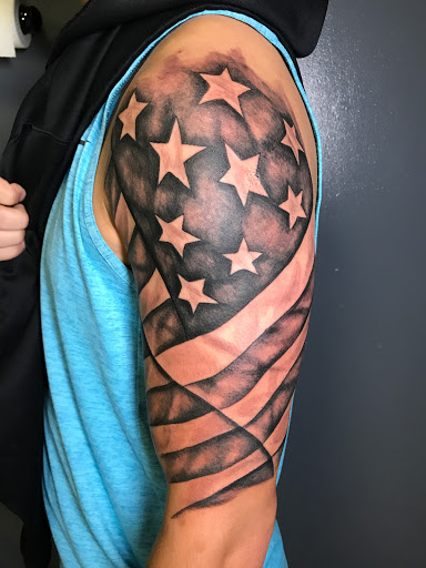 Explore cover up tattoo ideas on thigh, creative tattoo ideas in Conover, available at Polsons Tattoo Studio