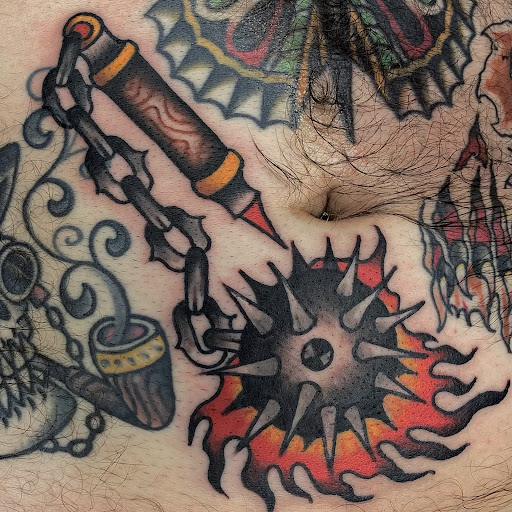 Explore flower back tattoo ideas, creative tattoo ideas in Johnson City, available at Gold Cross Tattoo Co.