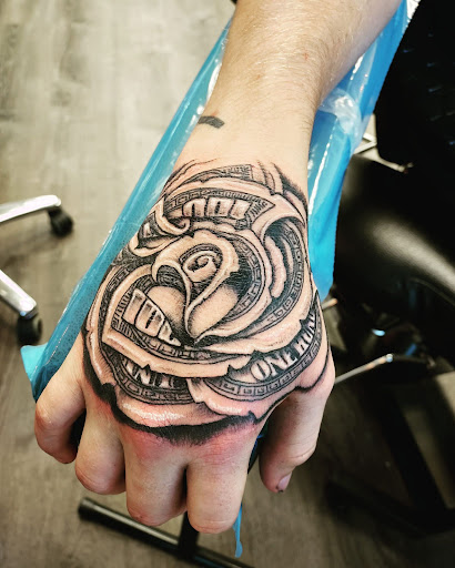 Explore red ink tattoo ideas for guys, creative tattoo ideas in Westland, available at Premier Tattoo Company Westland