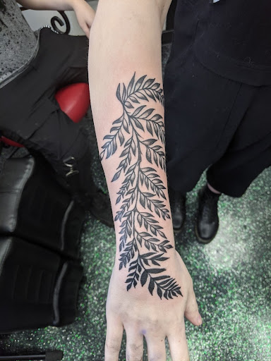 Explore shoulder tattoo ideas for men, creative tattoo ideas in Slippery Rock, available at Dinky Dachshund Tattoo Parlor