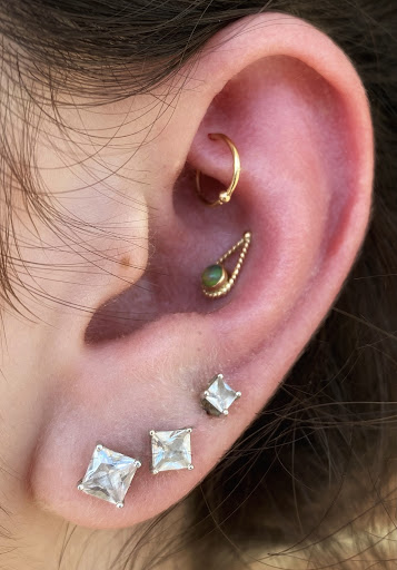 Explore electric guitar tattoo ideas, creative tattoo ideas in Greensboro, available at Fern Piercing and Fine Jewelry