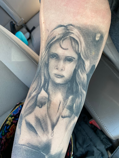 Find angel tattoo ideas for females for your next unique tattoo in Denton at Dark Age Tattoo Studio