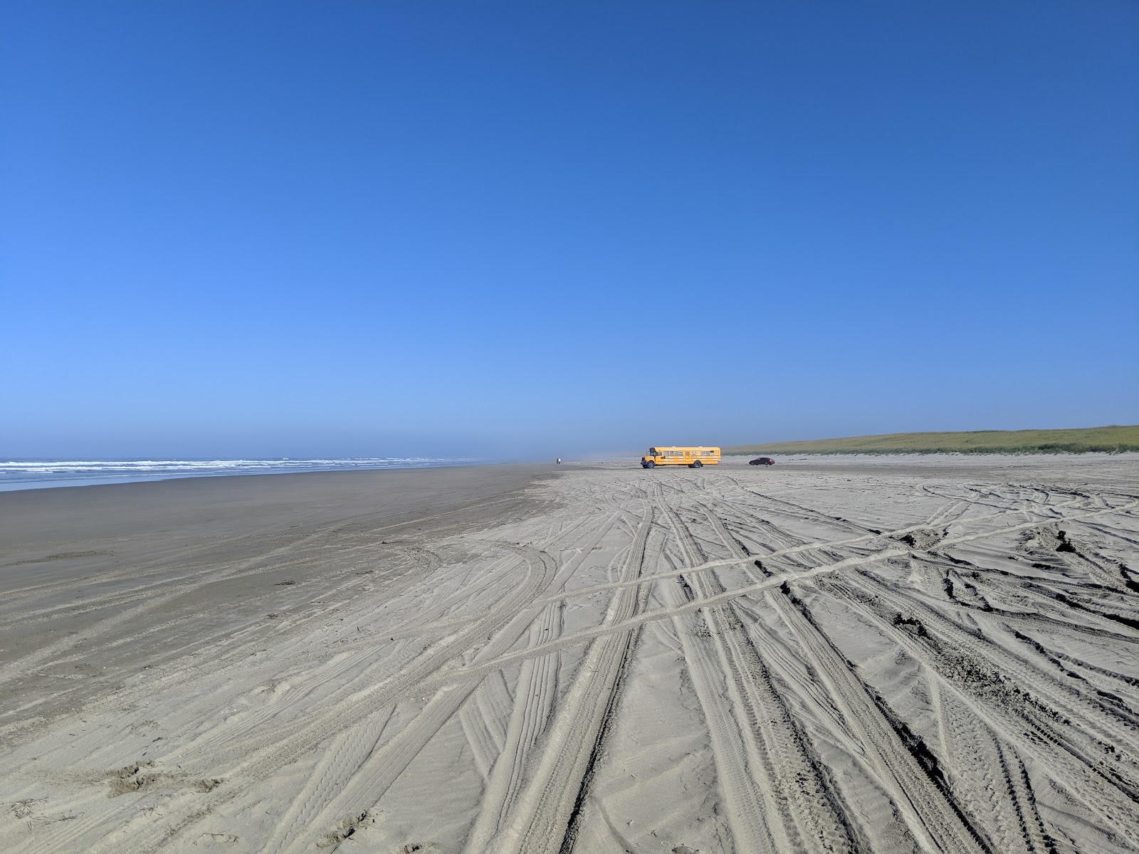 Fotografija Sunset Beach z svetel fin pesek površino