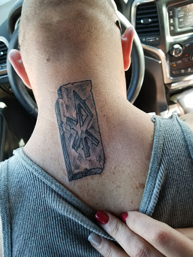 Find lion hand tattoo ideas for men for your next unique tattoo in Denver at Bound By Design