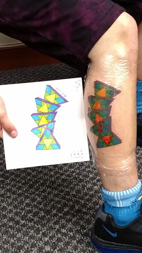 Explore barber pole tattoo ideas, creative tattoo ideas in Charlottesville, available at Mystic Tattoo and Body Piercing