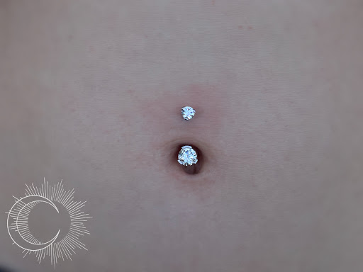 Find palm size tattoo ideas for females for your next unique tattoo in Appleton at Celestial Piercing- Inside of Big Guns Tattoo