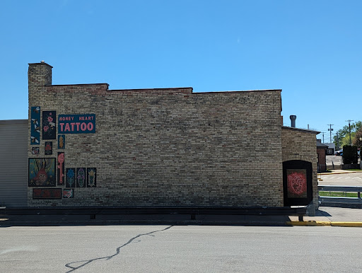 Explore meaningful elegant spine tattoo ideas, creative tattoo ideas in Clintonville, available at Honey Heart Tattoo