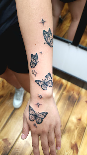 Explore tattoo ideas on back of neck, creative tattoo ideas in Sioux City, available at Thorn-Side Tattoo & Piercing