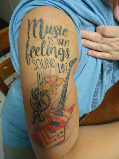 Explore forearm sleeve tattoo ideas for females, creative tattoo ideas in Angola, available at Hoodlum Ink