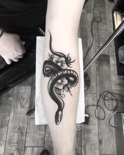 Explore sloth tattoo ideas, creative tattoo ideas in Lakeland, available at Black Swan Tattoo
