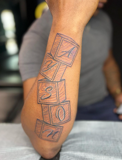 Explore fine line spine tattoo ideas, creative tattoo ideas in Prairieville, available at Kingdom Ink Quality Body Art