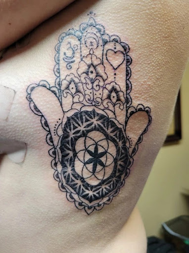 Explore rib tattoo ideas men, creative tattoo ideas in Waterloo, available at Friki Tiki Tattoo and Gallery