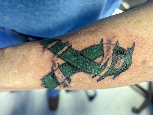 Explore snake tattoo idea, creative tattoo ideas in Cedar, available at Emerald Monkey Tattoo