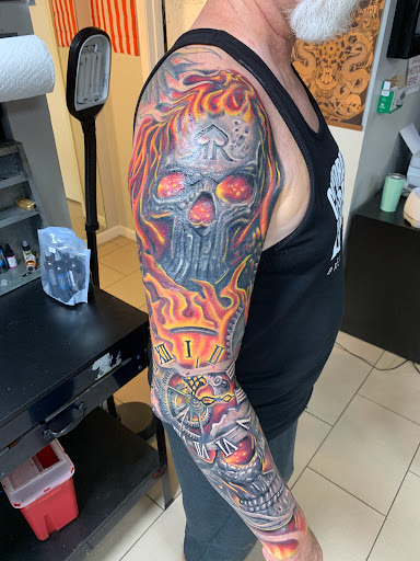 Explore tattoo scroll ideas, creative tattoo ideas in Sarasota, available at SEVEN SINS Tattoo Studio