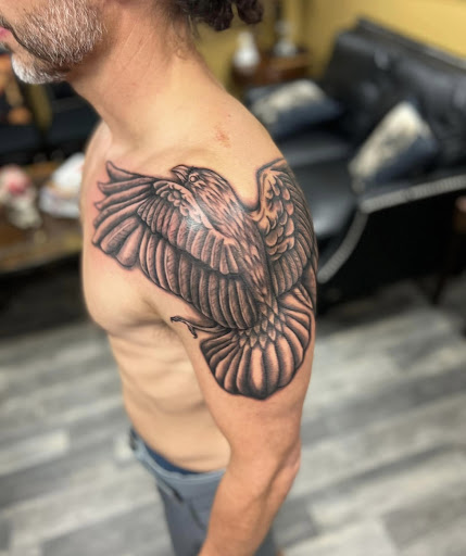 Explore shoulder tattoo ideas for guys, creative tattoo ideas in Warner Robins, available at Untold Pain Tattoo Studio