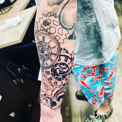 Explore granddaughter tattoo ideas for grandma, creative tattoo ideas in Lake City, available at Crooked Spines Tattoo Studio